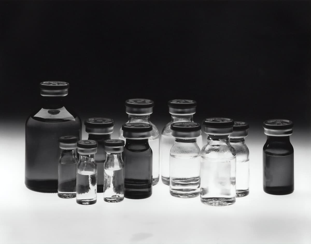 Grayscale photograph of empty glass test tubes